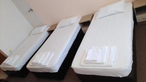A bed or beds in a room at Atliman Beach Park Hotel