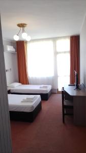 Postel nebo postele na pokoji v ubytování Atliman Beach Park Hotel