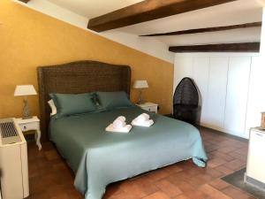 Llit o llits en una habitació de S. Faustino Rooms