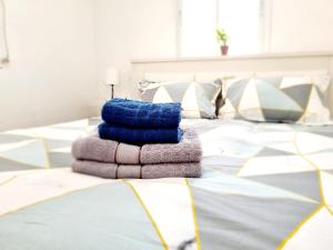 a pile of towels sitting on top of a bed at "In the heart of Acre" from Shneider Apartments in Acre