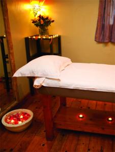 a bedroom with a bed and a bowl of christmas lights at Karama Lodge in Arusha