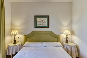 Posteľ alebo postele v izbe v ubytovaní Family villa in Torremirona Resort + 27 fotografií