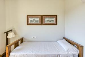 Posteľ alebo postele v izbe v ubytovaní Family villa in Torremirona Resort