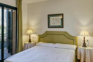 Posteľ alebo postele v izbe v ubytovaní Family villa in Torremirona Resort