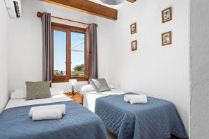 Postel nebo postele na pokoji v ubytování Sa Lluna + 18 fotografií