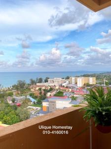 a view of a city from the balcony of a building at Ulique Homestay Batu Buruk in Kuala Terengganu