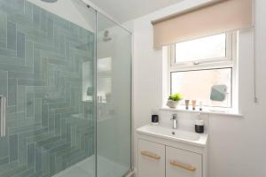 a bathroom with a shower and a sink at High Tide - Filey apartment close to beach in Filey