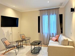 Telewizja i/lub zestaw kina domowego w obiekcie Itaca Sevilla by Soho Boutique