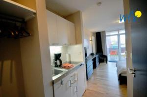 Kuchyň nebo kuchyňský kout v ubytování Barons Residenz Ferienwohnung 1
