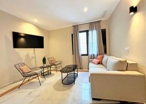 Telewizja i/lub zestaw kina domowego w obiekcie Itaca Sevilla by Soho Boutique