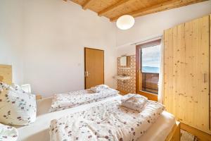 Ένα ή περισσότερα κρεβάτια σε δωμάτιο στο Eggerhof Familienparadies