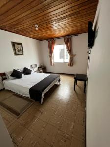 Hotel Alpino Armenia客房内的一张或多张床位