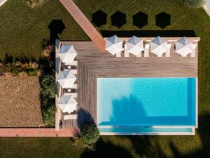 an overhead view of a swimming pool and a house at Ericeira Prime Villas in Ericeira