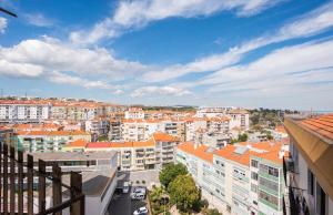 a view of a city with buildings and cars at Cardia’s Guest House in Sacavém