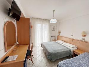 TV a/nebo společenská místnost v ubytování Hotel Rosetta