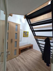 a room with a loft bed and a bench at Ferienwohnung, Ferienapartment, Monteurwohnung, in Wittlich