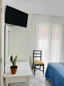 TV a/nebo společenská místnost v ubytování Hotel Rosetta