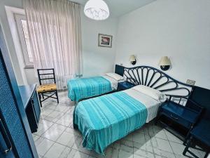 Postel nebo postele na pokoji v ubytování Hotel Rosetta