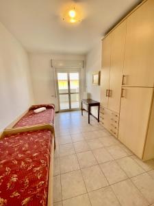 Postel nebo postele na pokoji v ubytování Appartamento Vista Mare con Spiaggia e Piscina + 33 fotografií