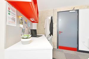 an office with a desk with a laptop on it at For Students Only Ensuite Bedroom at Beton House in Sheffield in Sheffield