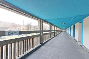 a hallway of a building with a blue ceiling at For Students Only Ensuite Bedroom at Beton House in Sheffield in Sheffield