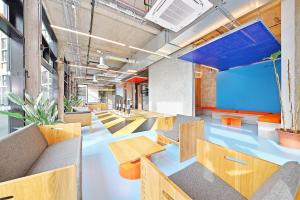 an office with blue floors and wooden tables and chairs at For Students Only Ensuite Bedroom with Shared Kitchen at Beton House in Sheffield in Sheffield