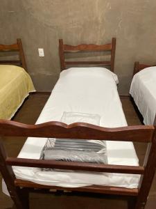 Säng eller sängar i ett rum på Pousada Gruta do Imigrante