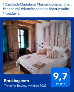 a poster for a hotel room with a bed at Casiña da Madalena in Ribadavia