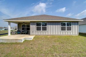 a small house with a porch and a yard at Foley Vacation Rental 7 Mi to Gulf Shores Beaches in Foley