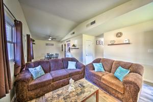 a living room with two couches and a table at Norfolk Vacation Rental Patio, 3 Mi to Beaches! in Norfolk
