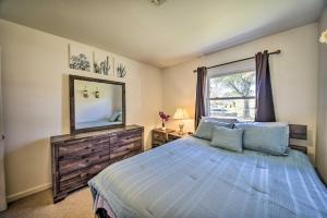 a bedroom with a bed and a mirror and a window at Norfolk Vacation Rental Patio, 3 Mi to Beaches! in Norfolk