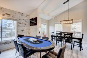 a dining room with a table and chairs at Lakefront Vacation Rental with Dock and Views! in Camdenton