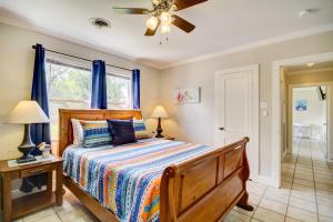 a bedroom with a bed and a ceiling fan at Coastal Long Beach Rental with Patio, Walk to Beach! in Long Beach