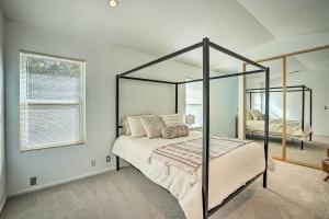 a bedroom with a canopy bed and a mirror at Bay Area Home Rental Near Six Flags and Napa Valley! in Vallejo