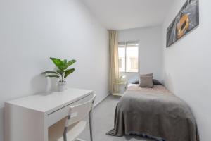 Posteľ alebo postele v izbe v ubytovaní Apartamento con terraza centrico