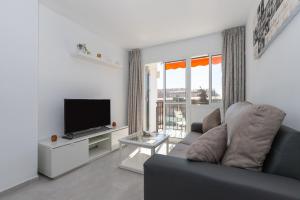 TV a/nebo společenská místnost v ubytování Apartamento con terraza centrico