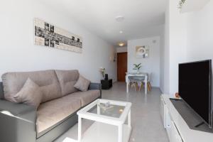 TV a/nebo společenská místnost v ubytování Apartamento con terraza centrico