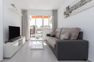 TV a/nebo společenská místnost v ubytování Apartamento con terraza centrico
