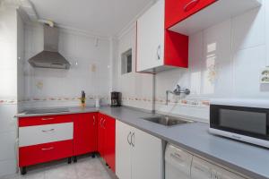 Kuchyň nebo kuchyňský kout v ubytování Apartamento con terraza centrico