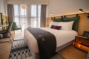 Postel nebo postele na pokoji v ubytování Met Hotel