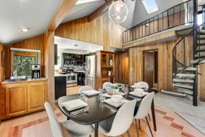 a dining room with a table and chairs at The Treehouse in Bellingham