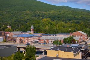 an aerial view of a town with a mountain at Hotel Downstreet in North Adams