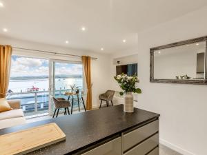 a living room with a view of the ocean at Estuary View in Exmouth