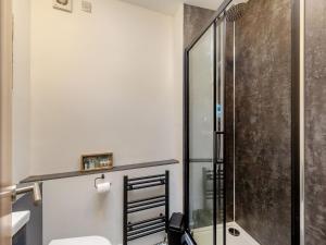 a bathroom with a shower and a toilet at Estuary View in Exmouth