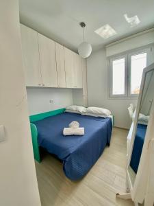 Postel nebo postele na pokoji v ubytování Appartamento al mare con giardino, spiaggia e piscina