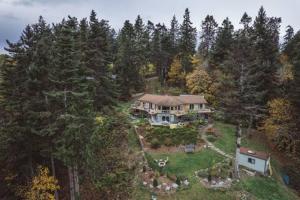 an aerial view of a large house in the woods at Sunrise Suite on the Sound in Anacortes