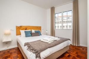 Postel nebo postele na pokoji v ubytování Ribeira do Esmeraldo by Madeira Sun Travel