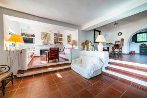 a living room with a couch and a table at Casa La Cúpula in Agua Amarga +23 photos