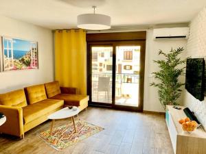 a living room with a couch and a table at Apartment Flamenca , Orihuela Costa in Orihuela