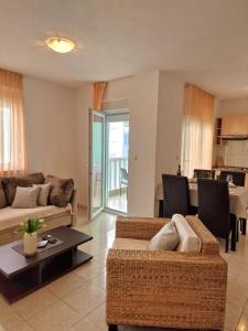 a living room with a couch and a table at Apartment Iva in Trogir